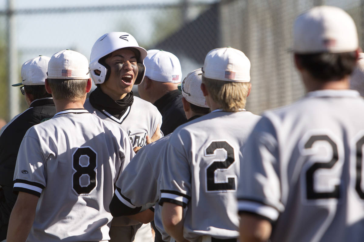 Palo Verde's outfielder Zach Helein (27) celebrates after scoring a run against Bishop Gorman d ...