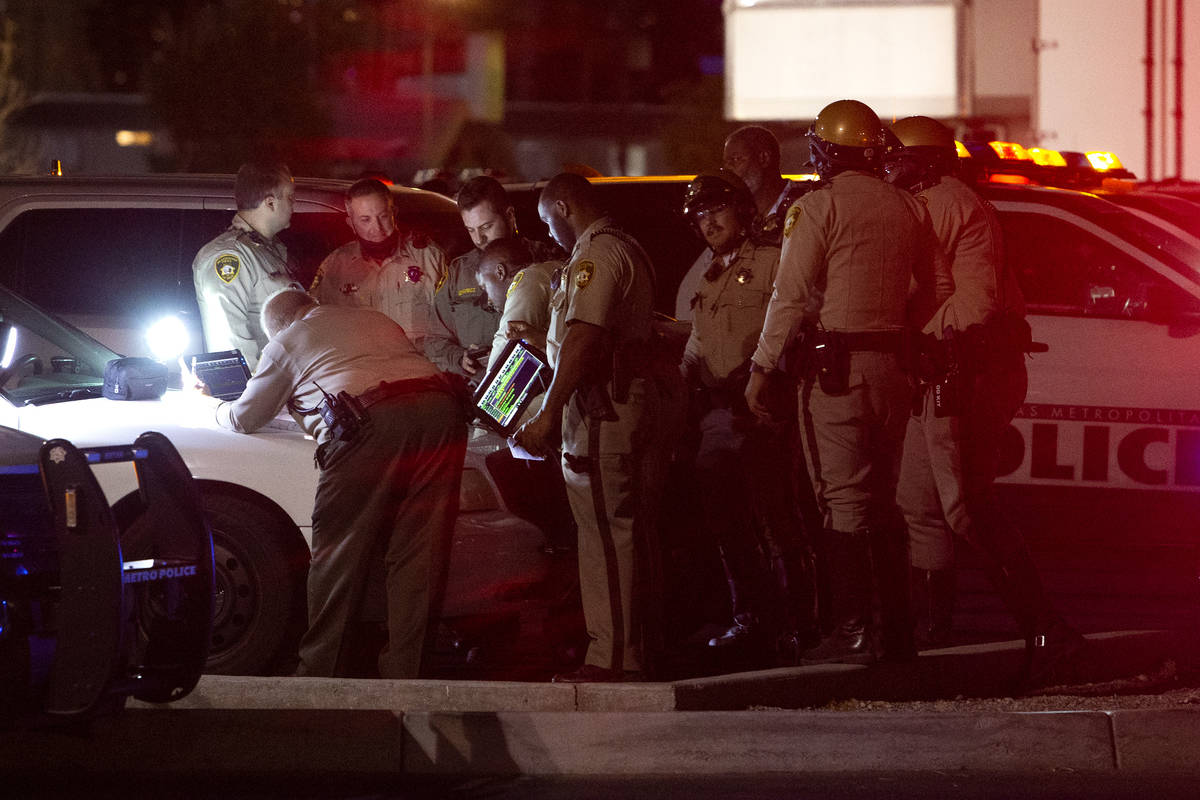 Metropolitan police have an incident command set up in a Lowe's parking lot while they investig ...