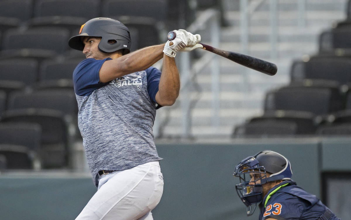 Aviators first baseman Edwin Diaz takes a swing during a simulated game at practice on Tuesday, ...