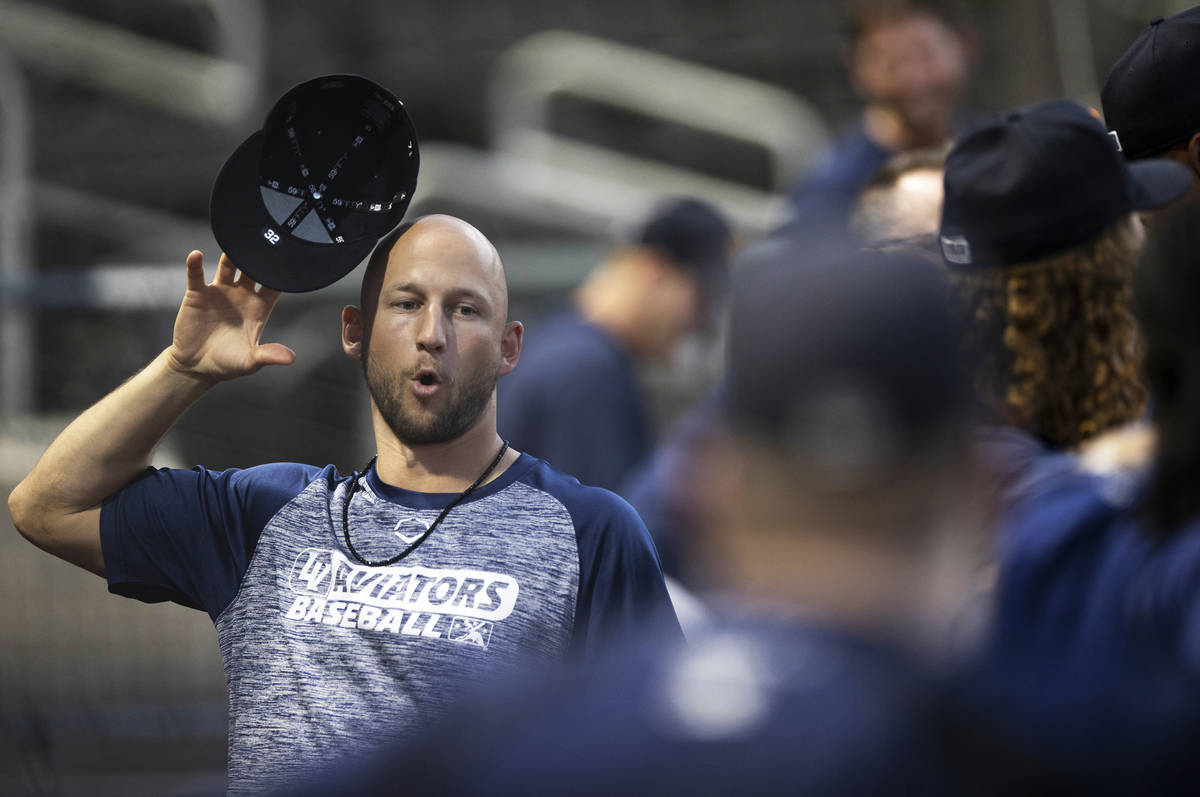 Aviators pitcher James Kaprielian flips his hat in the air during practice at Las Vegas Ballpar ...
