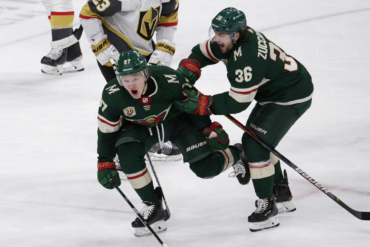 Minnesota Wild left wing Kirill Kaprizov (97) celebrates his goal with right wing Mats Zuccarel ...