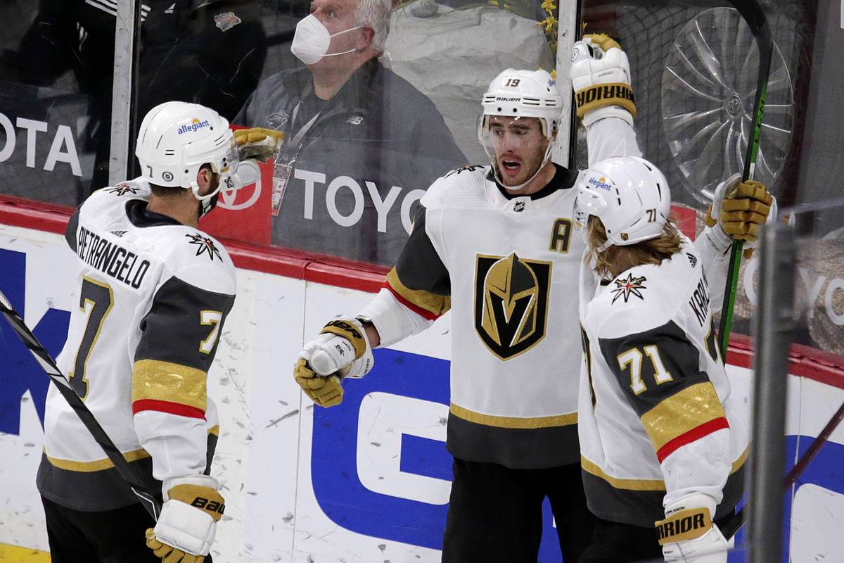 Vegas Golden Knights right wing Reilly Smith (19) is congratulated by defenseman Alex Pietrange ...