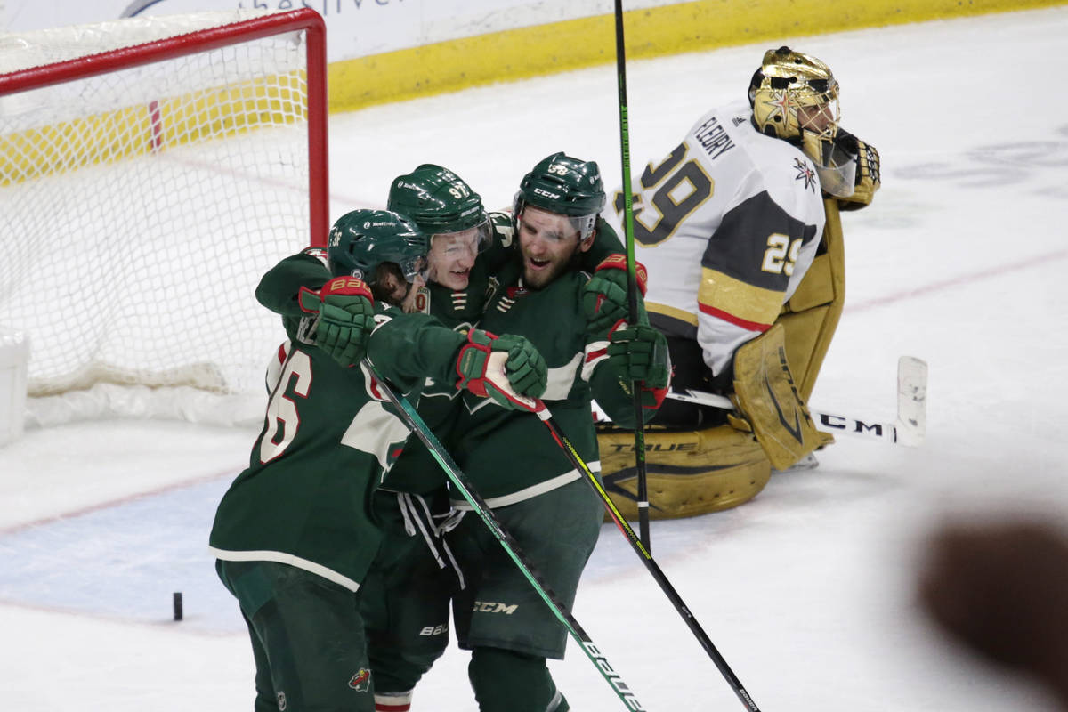 Minnesota Wild left wing Kirill Kaprizov (97) celebrates his goal with right wing Mats Zuccarel ...