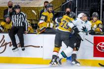 Golden Knights right wing Ryan Reaves (75) checks San Jose Sharks right wing Timo Meier (28) ha ...