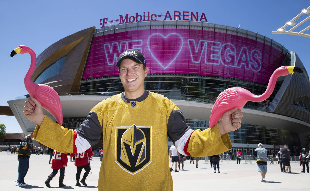 Drew Johnson holds plastic flamingo’s outside T-Mobile Arena on Saturday, May 8, 2021, i ...