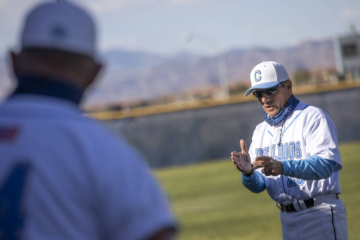 Centennial High School's baseball coach Charlie Cerrone speaks to his team in between innings d ...