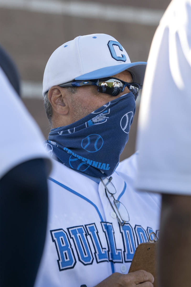 Centennial High School's baseball coach Charlie Cerrone speaks to his team in between innings d ...