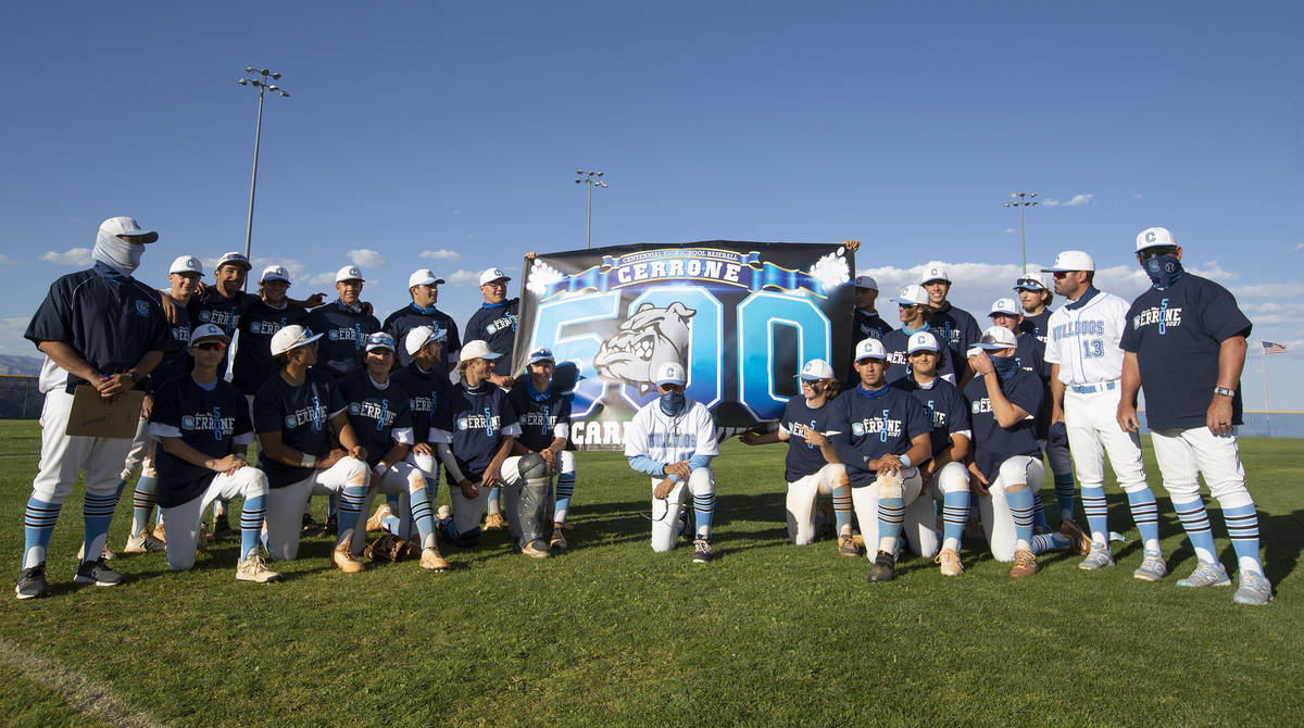 Centennial High School baseball team poses for a photo with their coach Charlie Cerrone after h ...