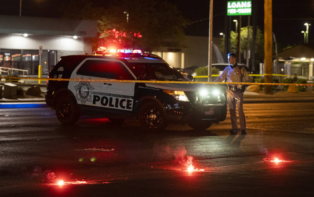 Officers investigate a fatal hit-and-run crash in northeast Las Vegas close to East Lake Mead B ...