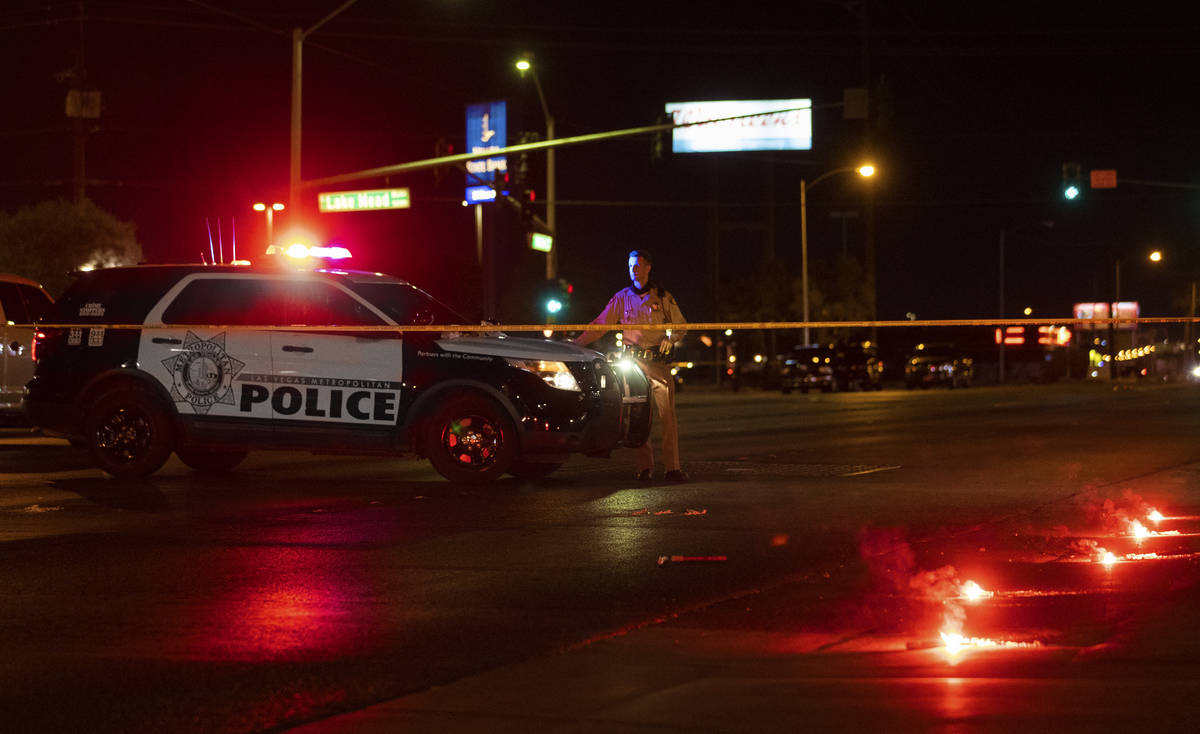 Officers investigate a fatal hit-and-run crash in northeast Las Vegas close to East Lake Mead B ...