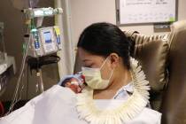 In this undated photo provided by Hawaii Pacific Health, Lavinia "Lavi" Mounga holds ...