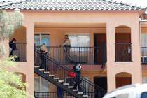 Las Vegas police and their Crime Scene Investigations team leave an apartment unit in Emerald S ...