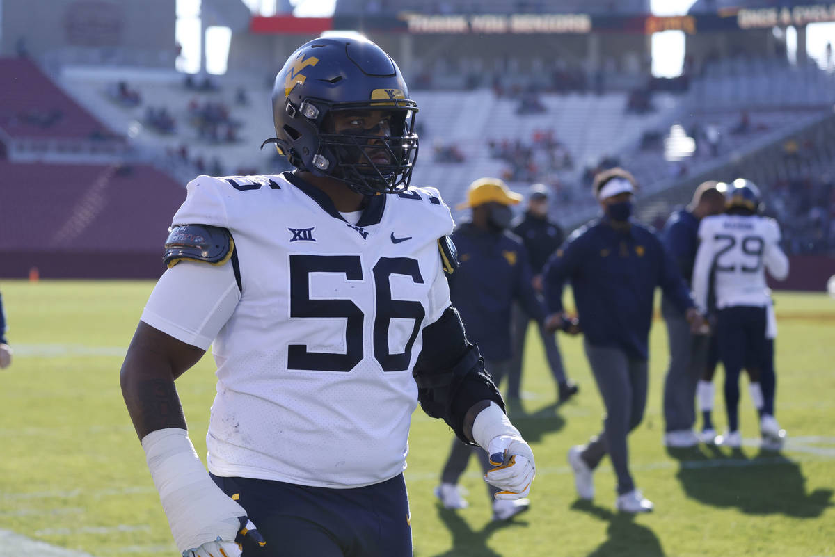 West Virginia defensive lineman Darius Stills walks off the field after warm ups before an NCAA ...