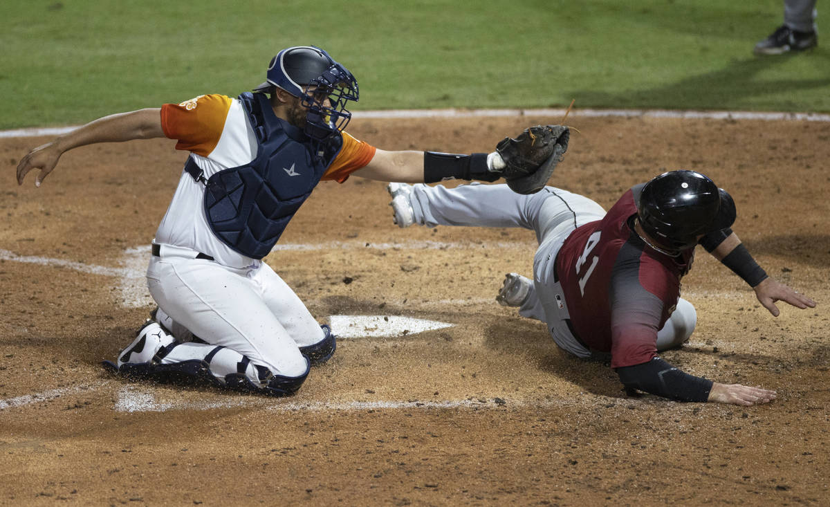 Las Vegas Aviators catcher Carlos P rez (23) tags out Sacramento