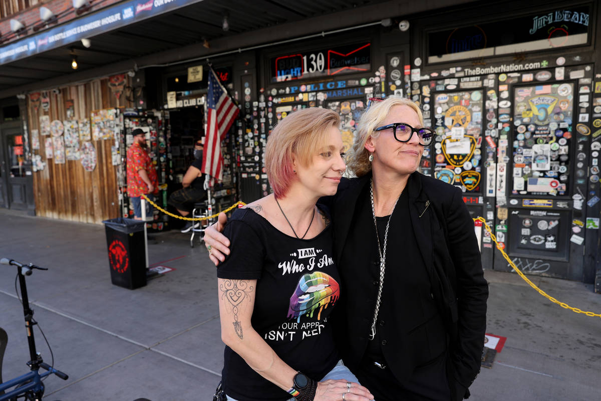 Michelle Dell, owner of Hogs & Heifers Saloon, right, at her bar on Third Street in downtown La ...