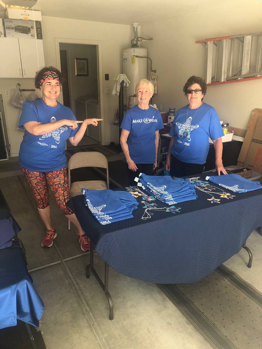 Cottonwood Terrace resident Ruth Furman and friends distribute specialty T-shirts to residents ...
