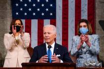 Vice President Kamala Harris and House Speaker Nancy Pelosi of Calif., stand and applaud as Pre ...