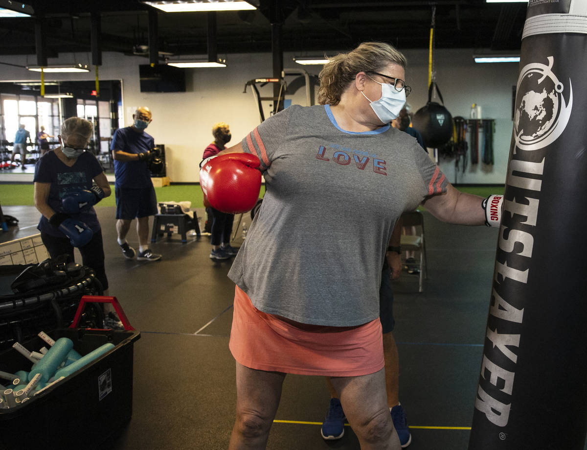 Gwen Vaughn, 48, punches the bag during her first boxing class at Tony Cress Training Center, o ...