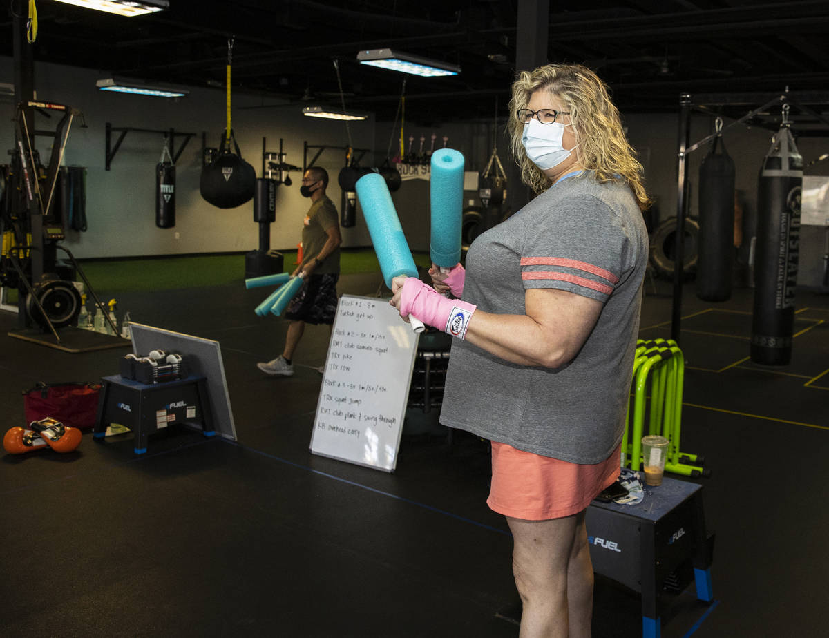 Gwen Vaughn, 48, warms up prior to her first boxing class at Tony Cress Training Center, on Fri ...