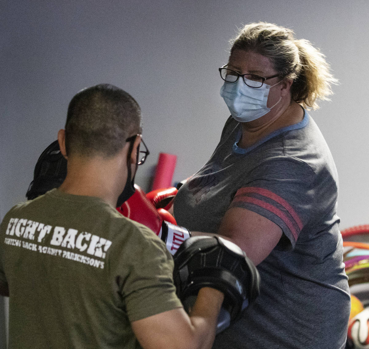 Gwen Vaughn, 48, works with Orlando Illustrismo, head coach, during her first boxing class at T ...