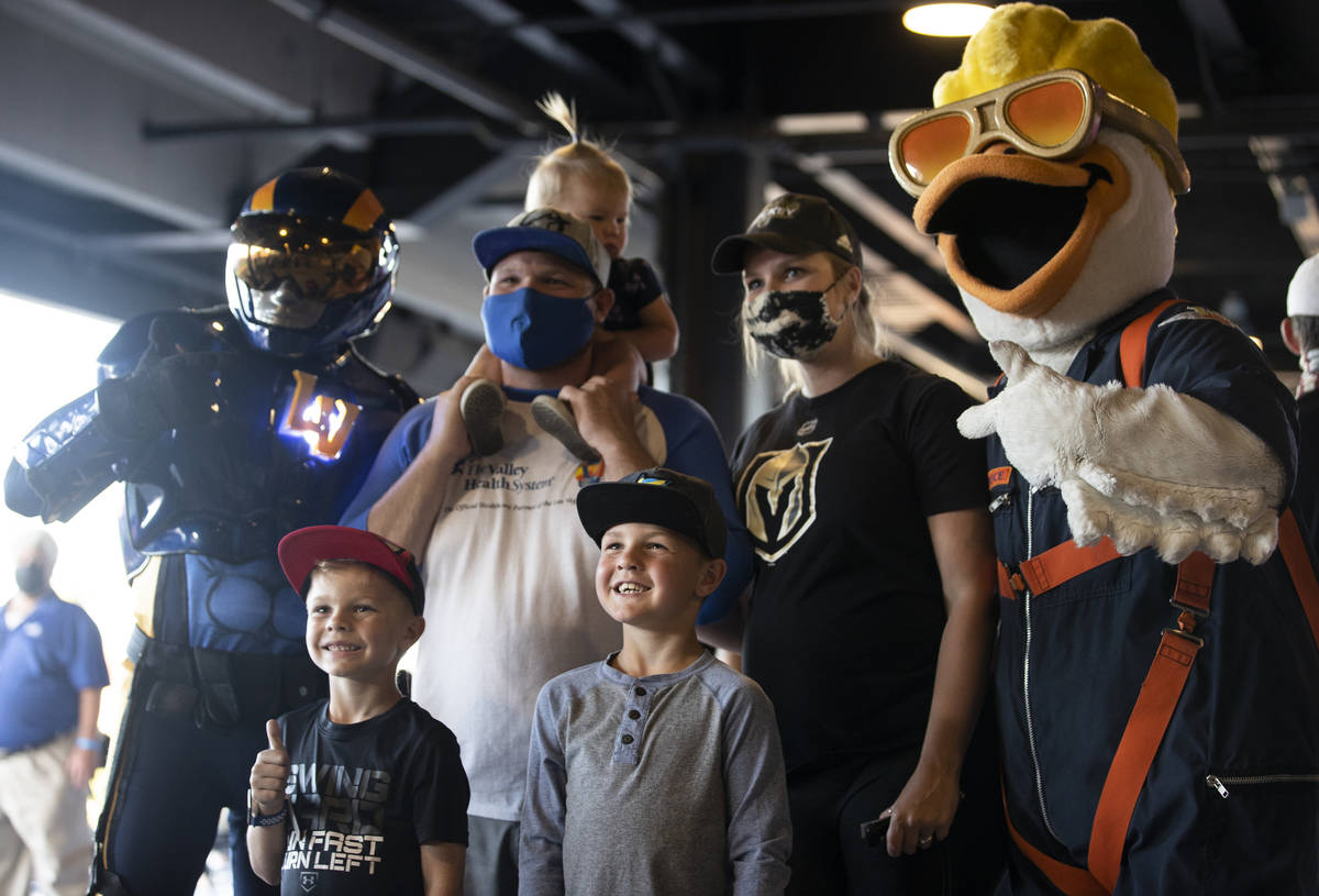 Aviator, left, Bowen, Jeremiah, Oakley, Ryder and Taylor Gutierrez pose with Spruce the Goose b ...