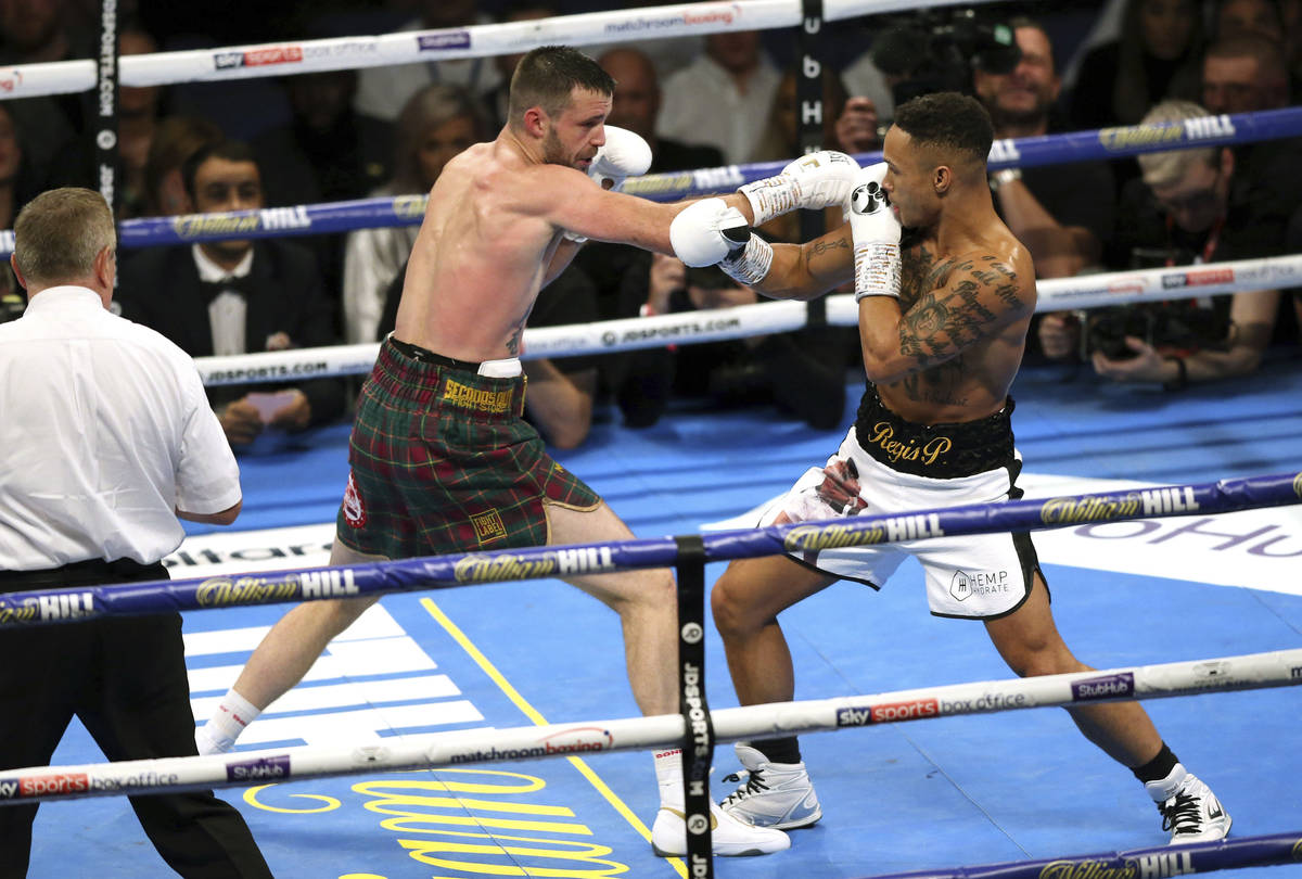 Josh Taylor, left, and Regis Prograis fight during their super-lightweight unification boxing m ...