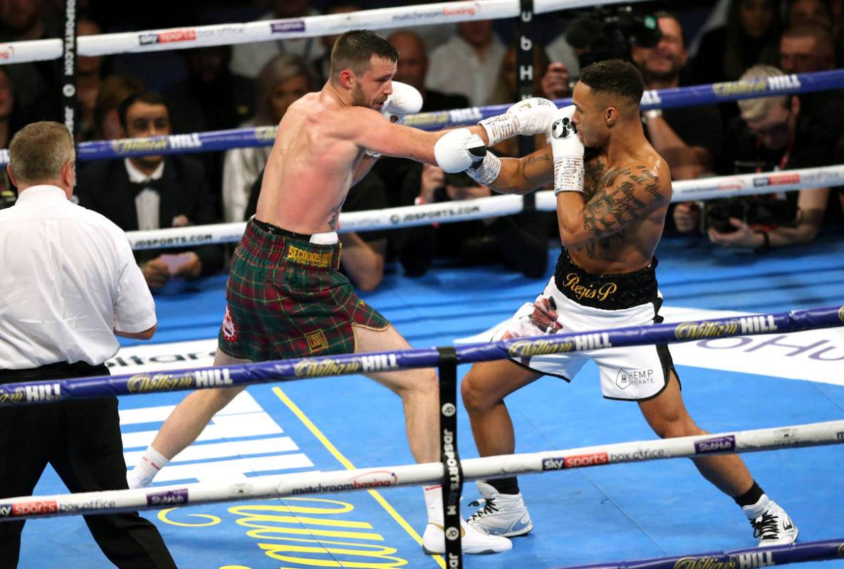 Josh Taylor, left, and Regis Prograis fight during their super-lightweight unification boxing m ...