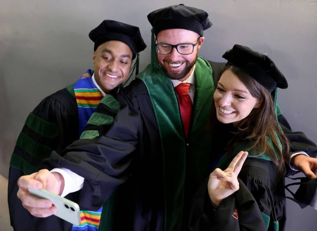 Members of the first graduating class of medical doctor students from the Kirk Kerkorian School ...