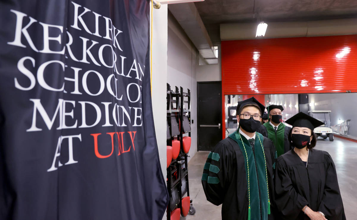 Toyokazu Endo and his mother Masae Endo, who will be doing his hooding, before the graduation c ...