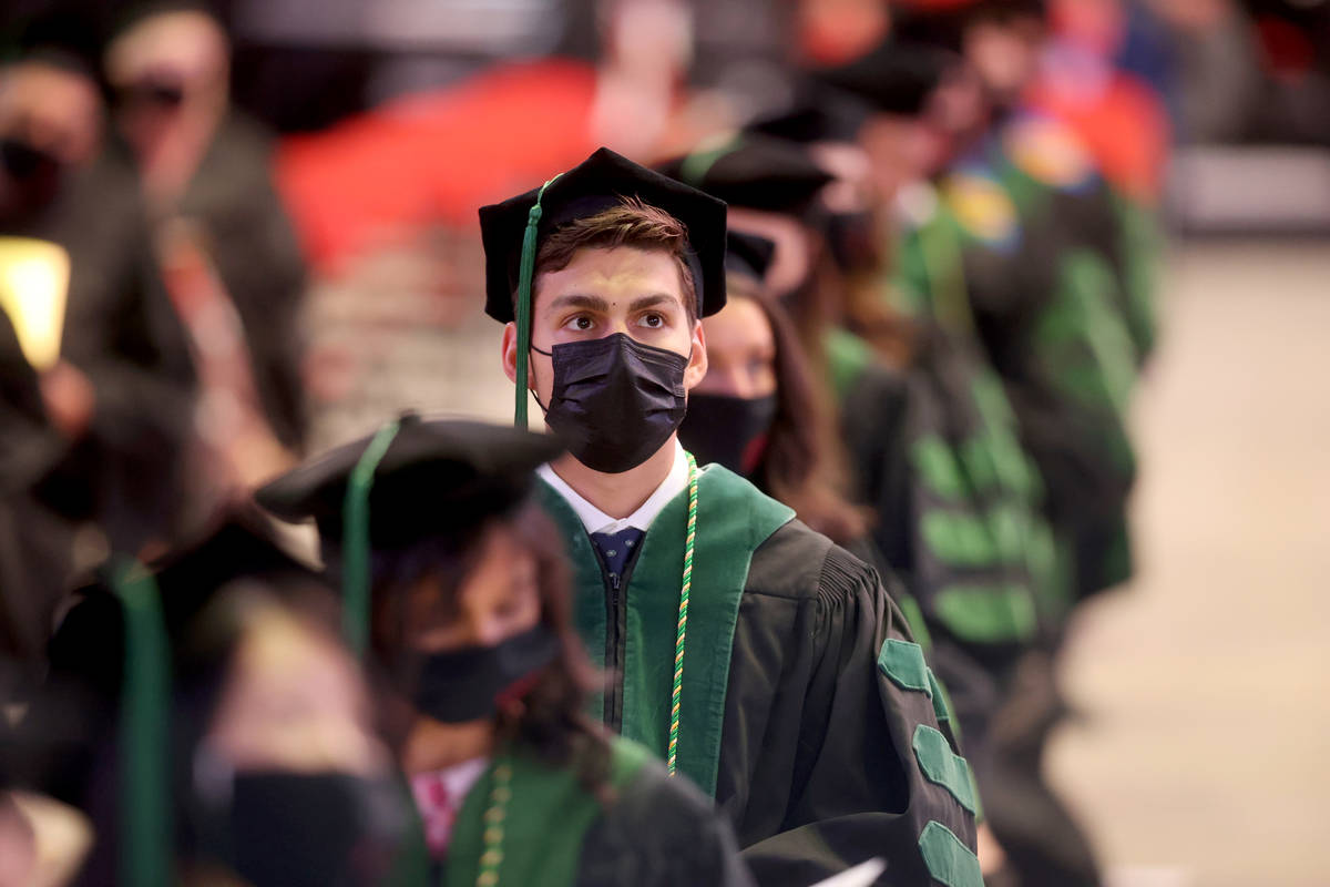 Members of the first graduating class of medical doctor students from the Kirk Kerkorian School ...