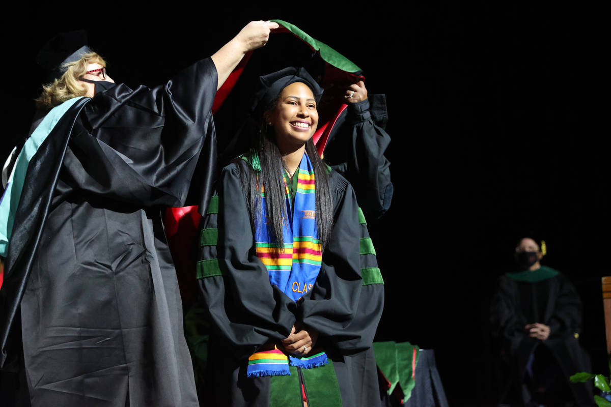 Lauren Hollifield is hooded as part of the first graduating class of medical doctor students fr ...