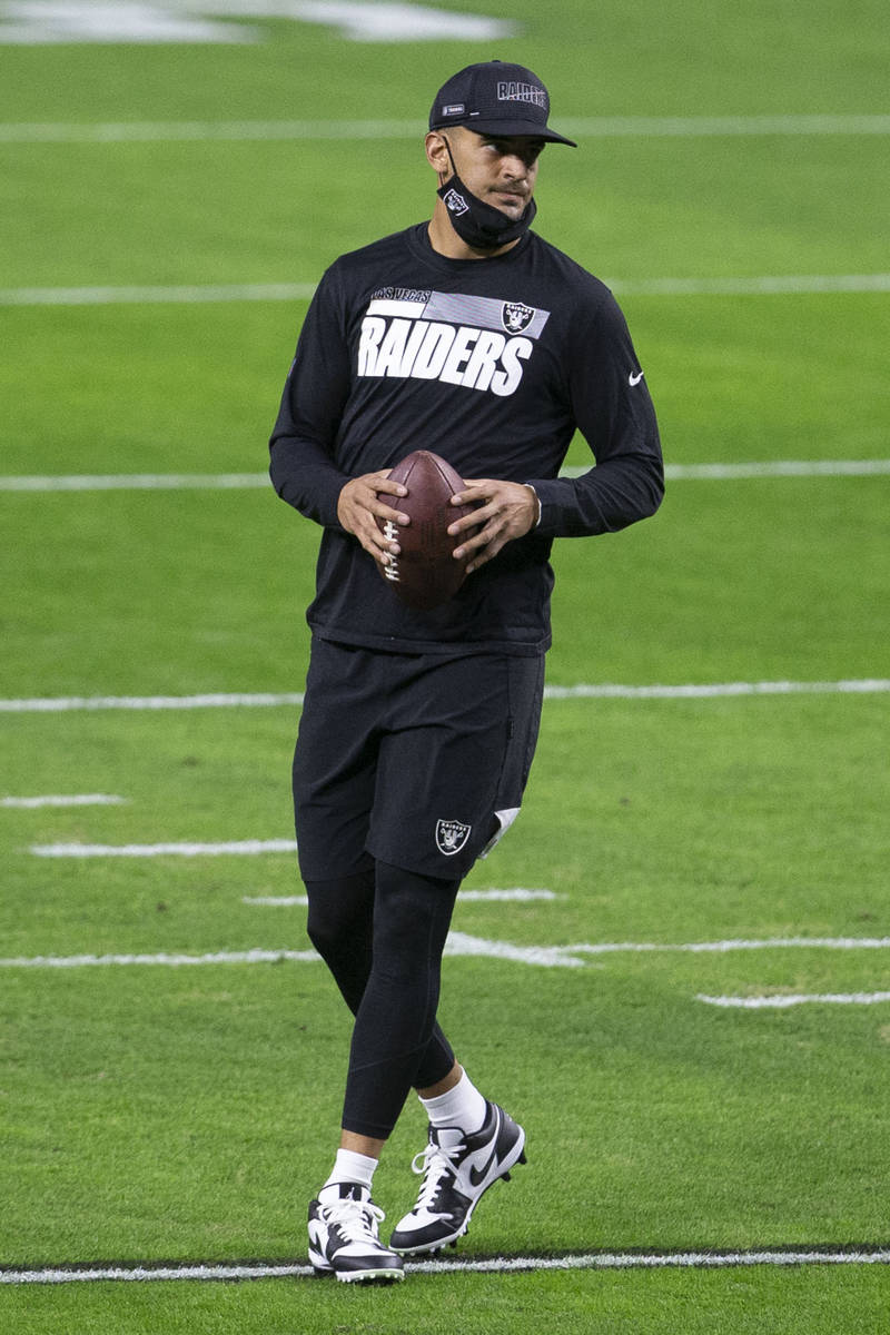 Raiders quarterback Marcus Mariota (8) warms up before an NFL football game against the Miami D ...