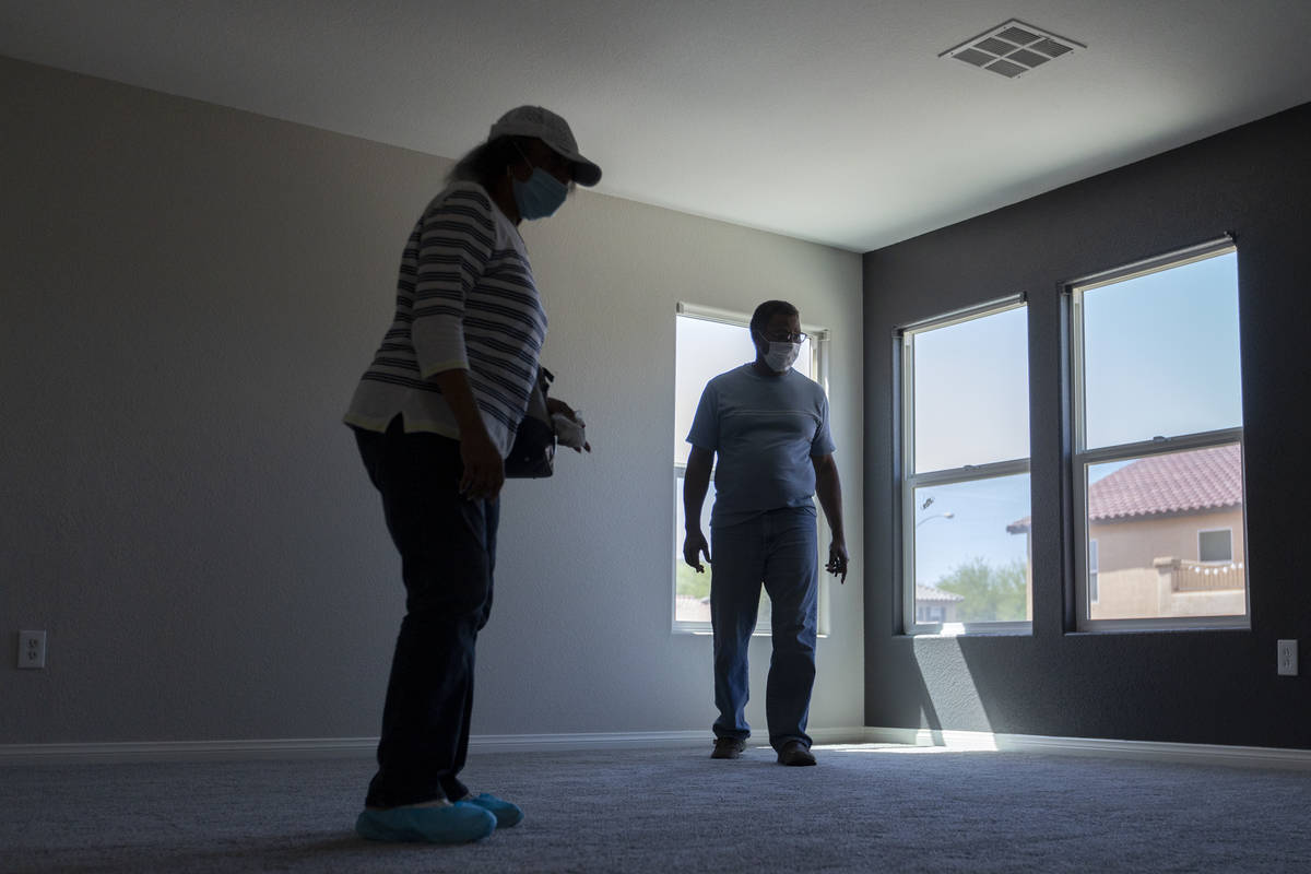 Evelyn Williams and Daryl Williams view the second floor during an open house at 2412 Craggy Le ...
