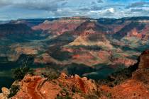 Visitors hike along the South Rim of the Grand Canyon in Grand Canyon, Ariz., in 2005. (AP Phot ...