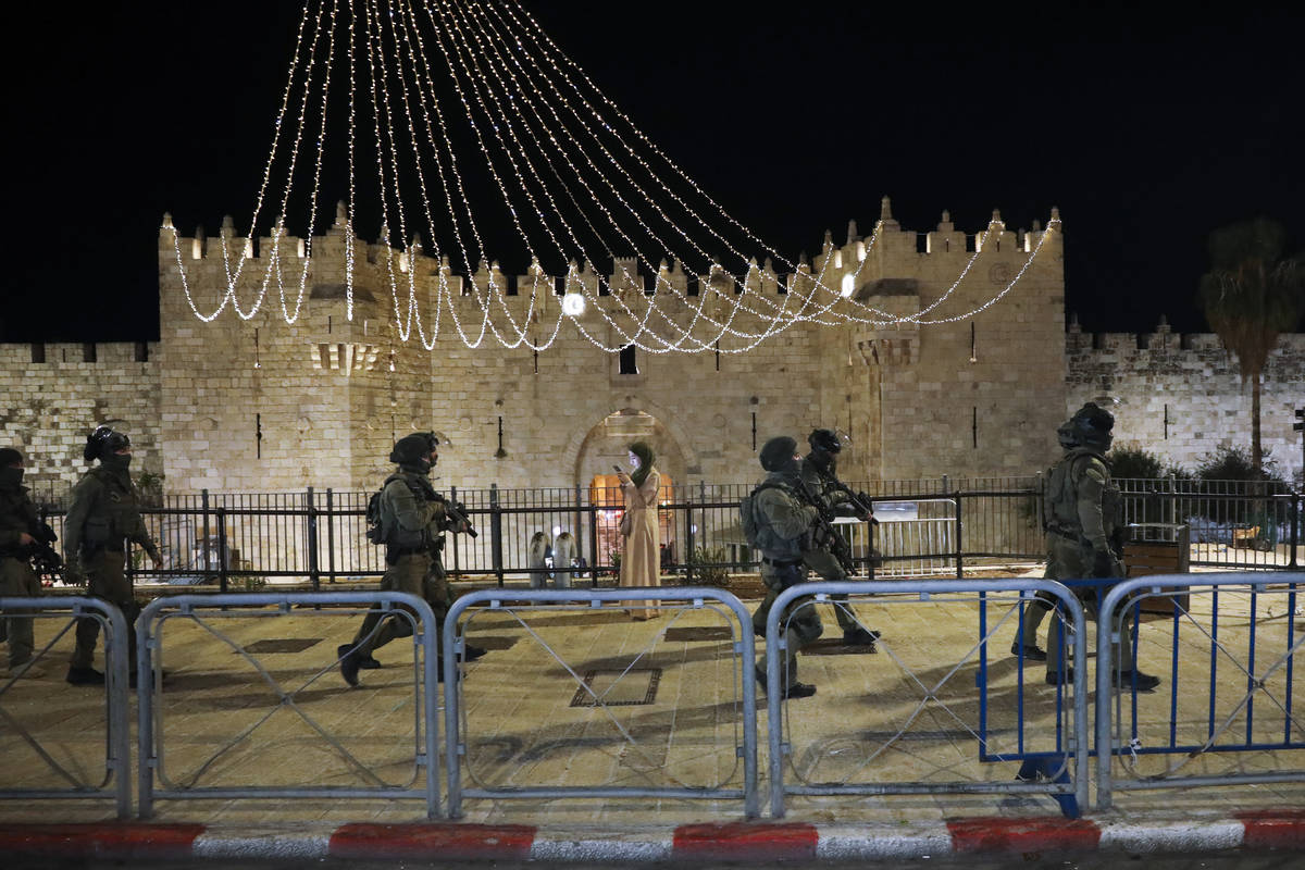 Israeli border police officers deploy during clashes with Palestinian protesters next to Damasc ...