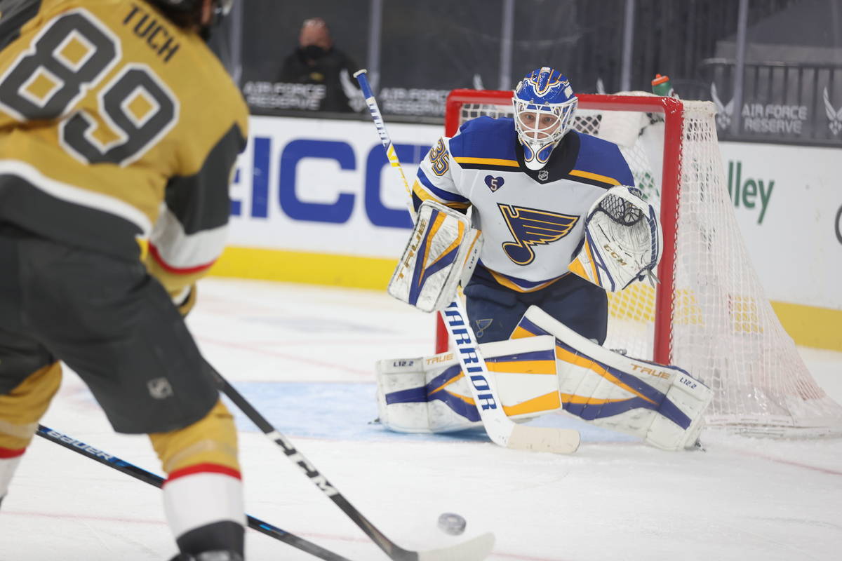 St. Louis Blues goaltender Ville Husso (35) defends a shot by Vegas Golden Knights right wing A ...