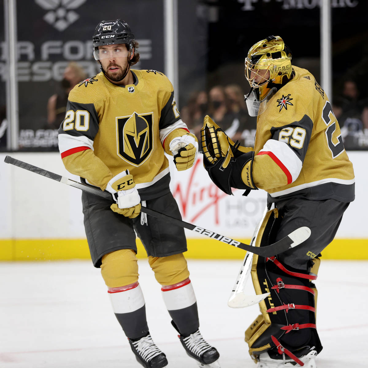 Vegas Golden Knights center Chandler Stephenson (20) celebrates his goal with goaltender Marc-A ...