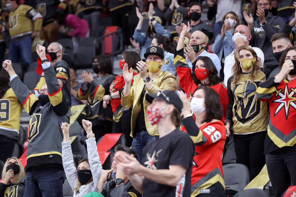 Fans celebrate a score by the Vegas Golden Knights gains the St. Louis Blues during the third p ...