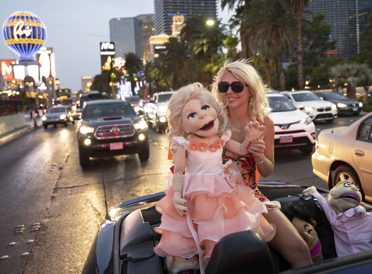 Actress and comedian April Brucker drives south in a motorcade of entertainment workers on the ...