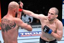 Alex Morono punches Donald 'Cowboy' Cerrone in a welterweight fight during the UFC Fight Night ...