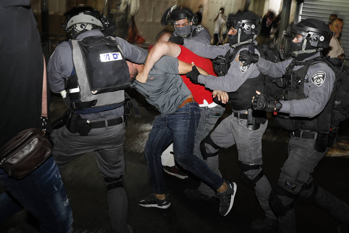 Israeli police officers clash with Palestinian protesters near Damascus Gate just outside Jerus ...