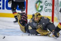 Golden Knights goaltender Marc-Andre Fleury (29) laughs while rejecting teammates shots during ...