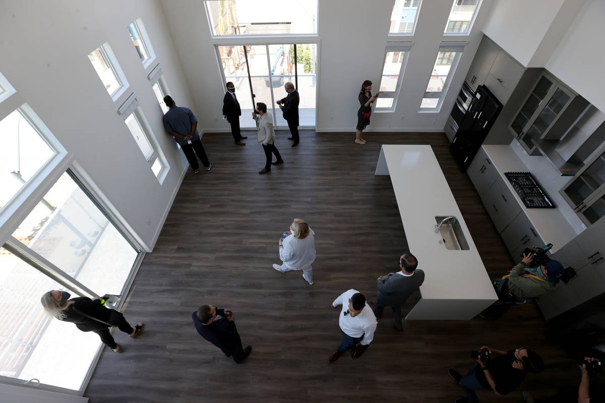 People check out a penthouse at Parc Haven apartment complex at Symphony Park in downtown Las V ...