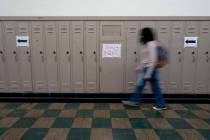 A student walks between classes at Wyandotte High School in Kansas City, Kan., on the first day ...