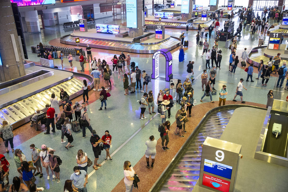 Travelers at McCarran International Airport Terminal 1 in Las Vegas, Thursday, May 13, 2021. (E ...