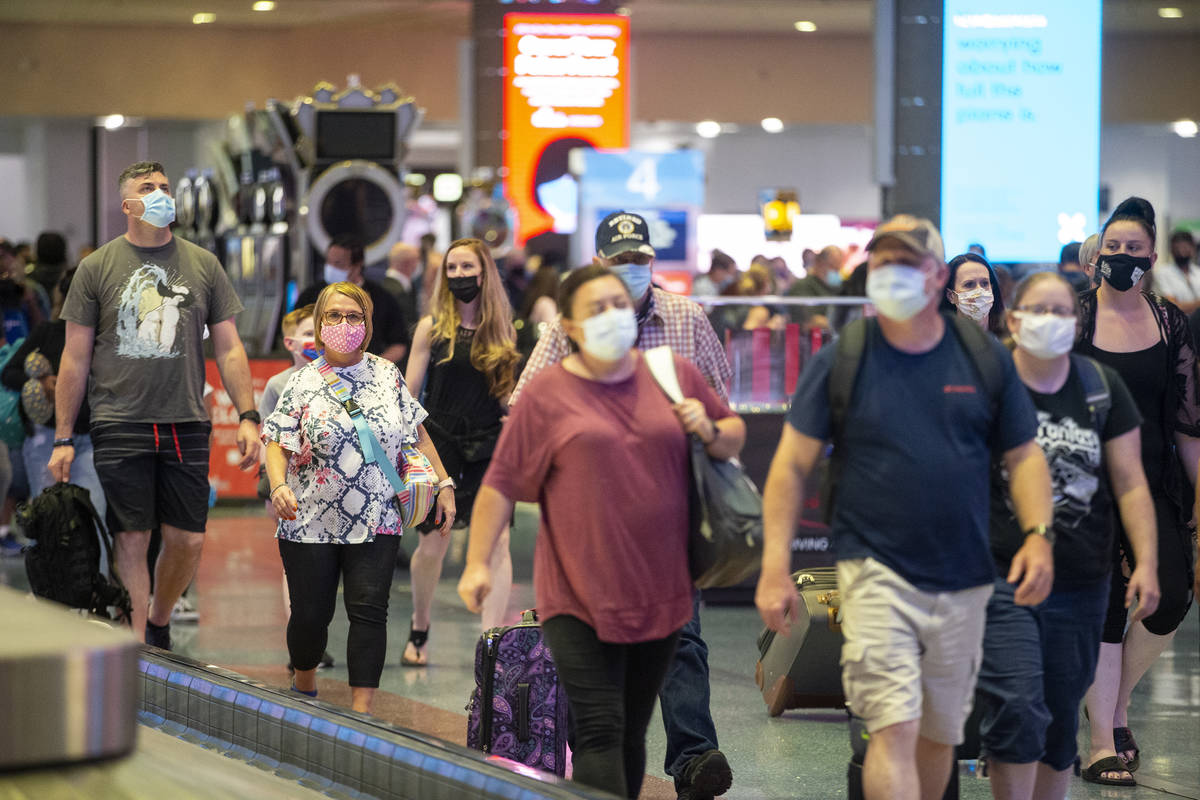 Travelers arrive to McCarran International Airport Terminal 1 in Las Vegas, Thursday, May 13, 2 ...