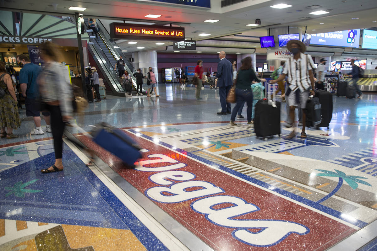 Travelers arrive to McCarran International Airport Terminal 1 in Las Vegas, Thursday, May 13, 2 ...