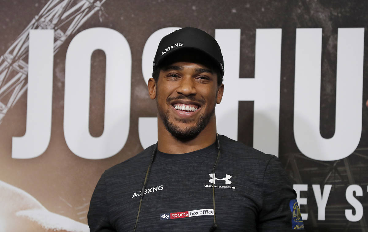 In this Sept. 20, 2018, file photo, Britain's Anthony Joshua smiles during a press conference a ...
