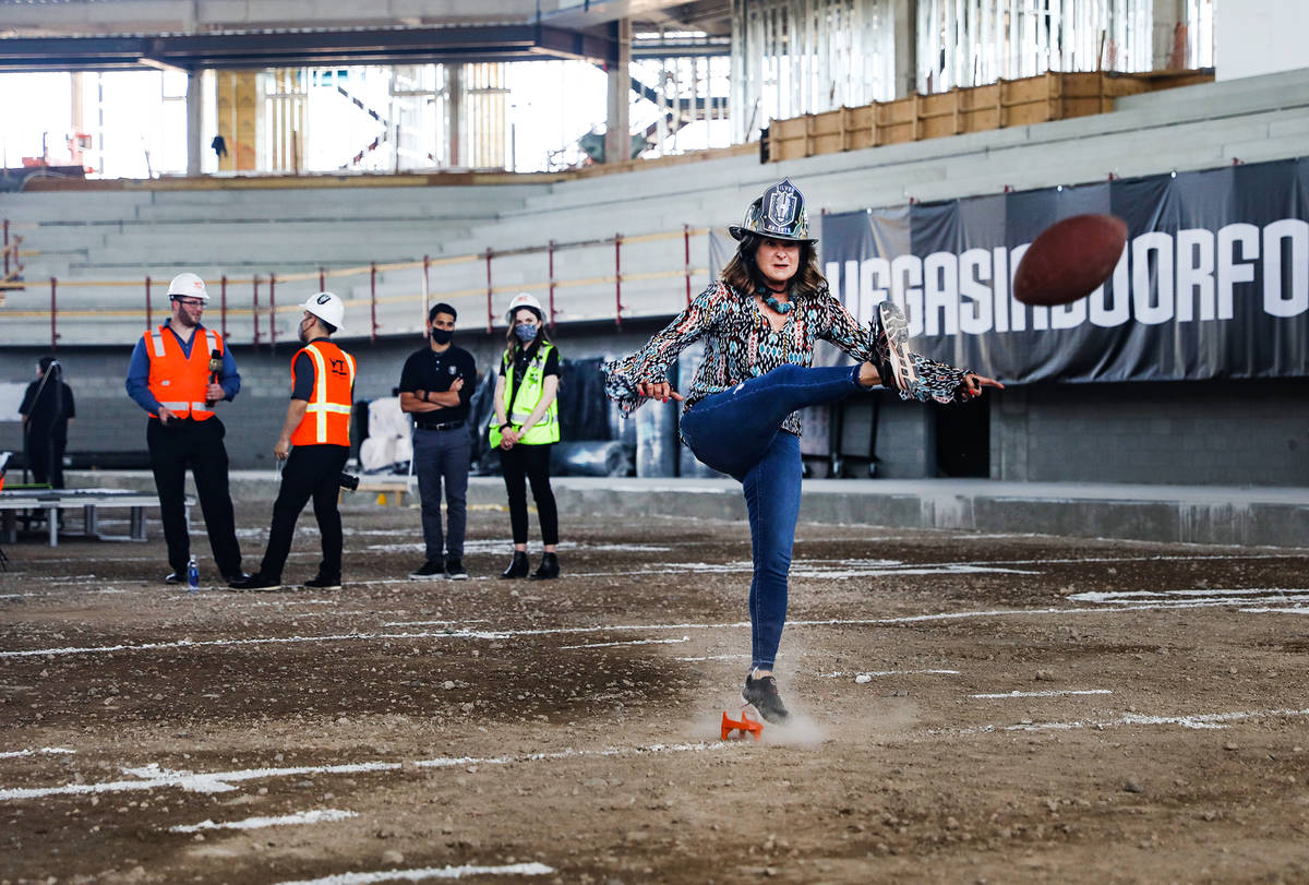 Henderson Mayor Debra March attempts a field goal at an event to announce that the Golden Knigh ...