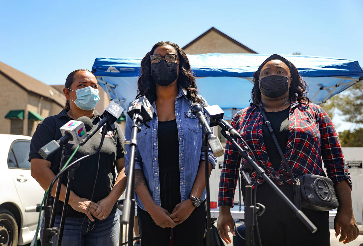 Yolanda Everett, aunt of 2-year-old Amari Nicholson who vanished last week, center, addresses t ...